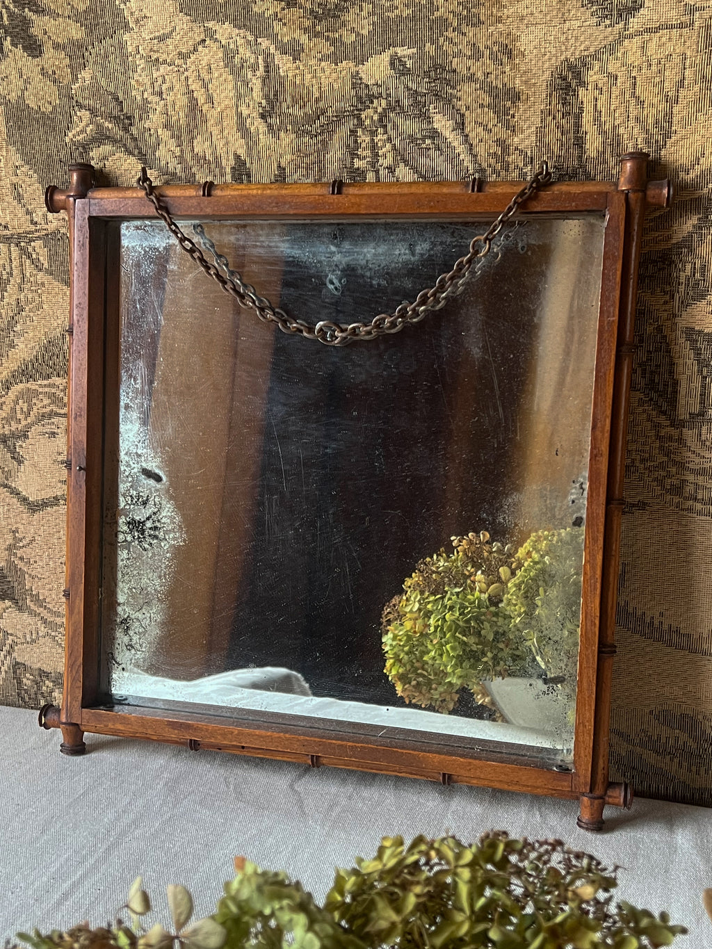 Antique French  wooden mirror in bamboo style with chain. Side view. 