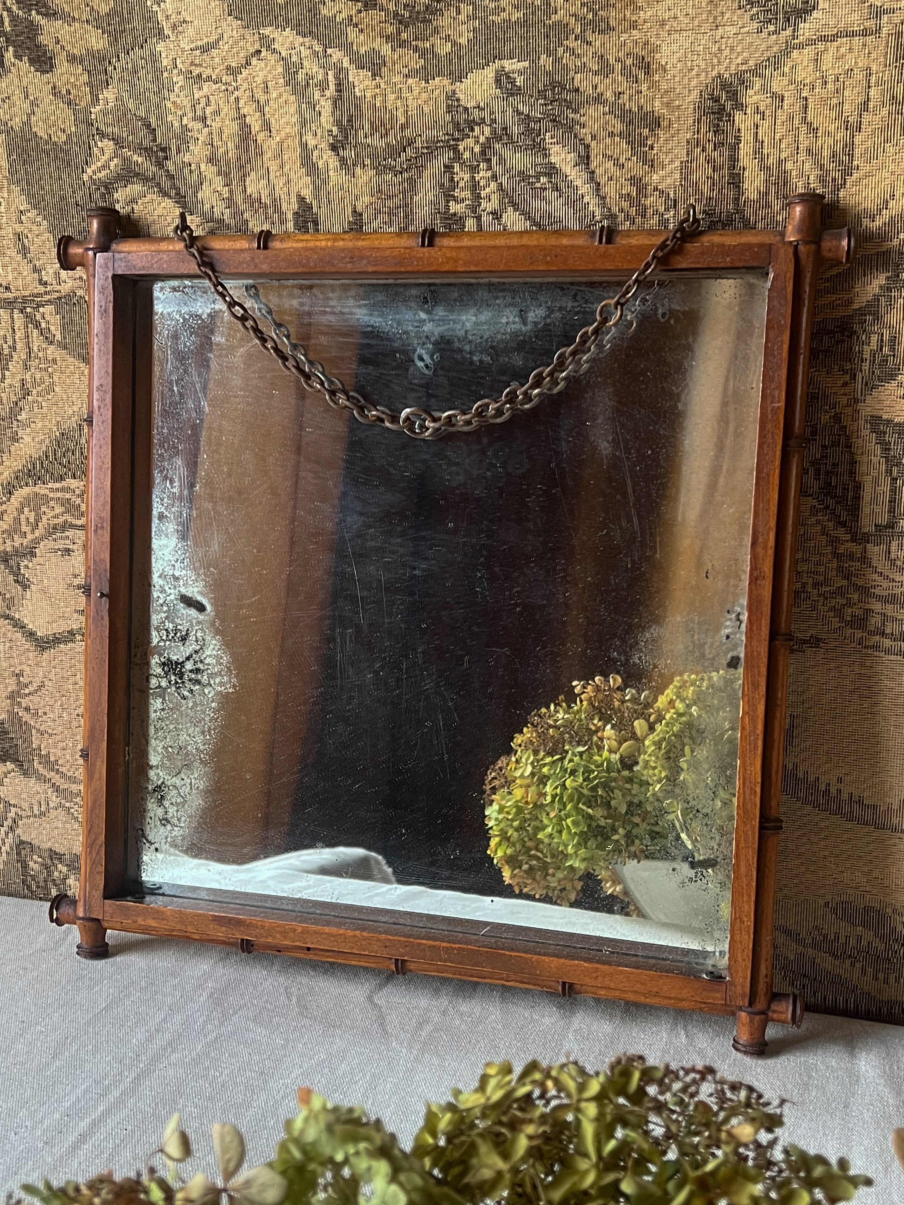 Antique French  wooden mirror in bamboo style with chain. Side view. 